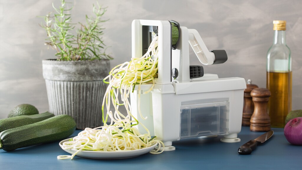 Spiralizer turning zucchini into noodles.