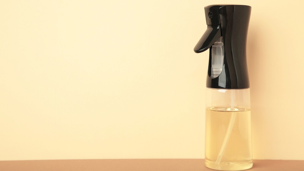 Oil sprayer bottle on a neutral background.