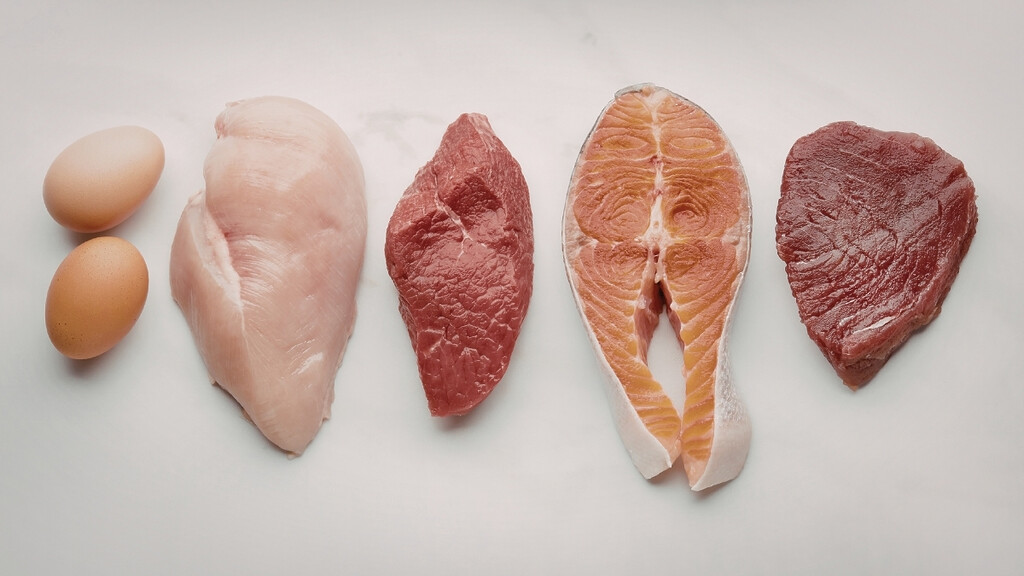Fresh of raw beef and salmon fillets eggs and chicken