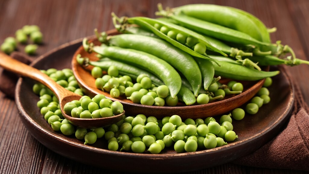 Fresh green peas in pods.