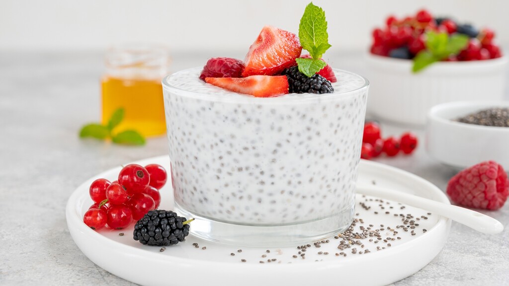 Chia seed pudding topped with strawberries, raspberries, blackberries, and currants.