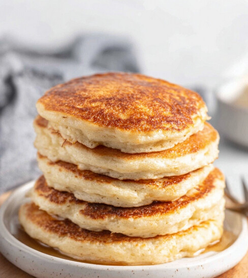 Dash friendly Cottage Cheese Pancakes - freshly cooked stack with syrup before final garnish