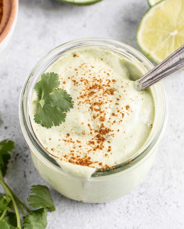 Top shot of the sauce after pouring it into the jar and decorating it with a cilantro leaf and a sprinkle of spices before serving.